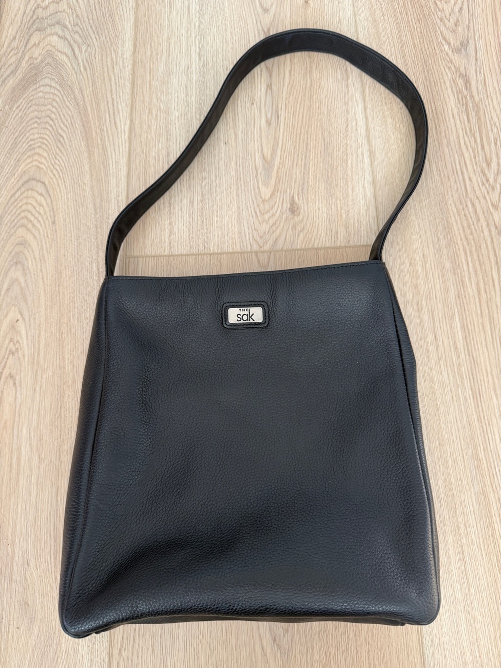 The Sak Black Pebbled Shoulder Bag
Zip Top Organizer Purse Silver Logo